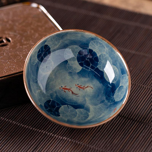 Handcrafted Jian Zhan Jingdezhen Porcelain Tea Cup with Blue & White Lotus Fish Design