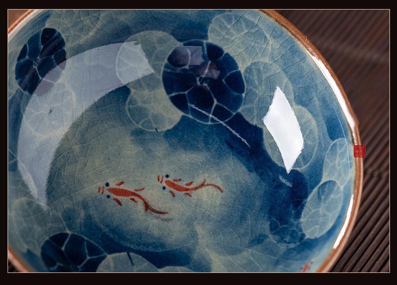 Handcrafted Jian Zhan Jingdezhen Porcelain Tea Cup with Blue & White Lotus Fish Design
