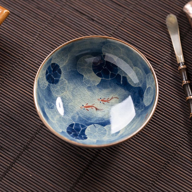 Handcrafted Jian Zhan Jingdezhen Porcelain Tea Cup with Blue & White Lotus Fish Design