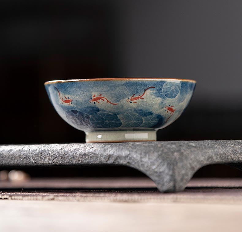 Handcrafted Jian Zhan Jingdezhen Porcelain Tea Cup with Blue & White Lotus Fish Design
