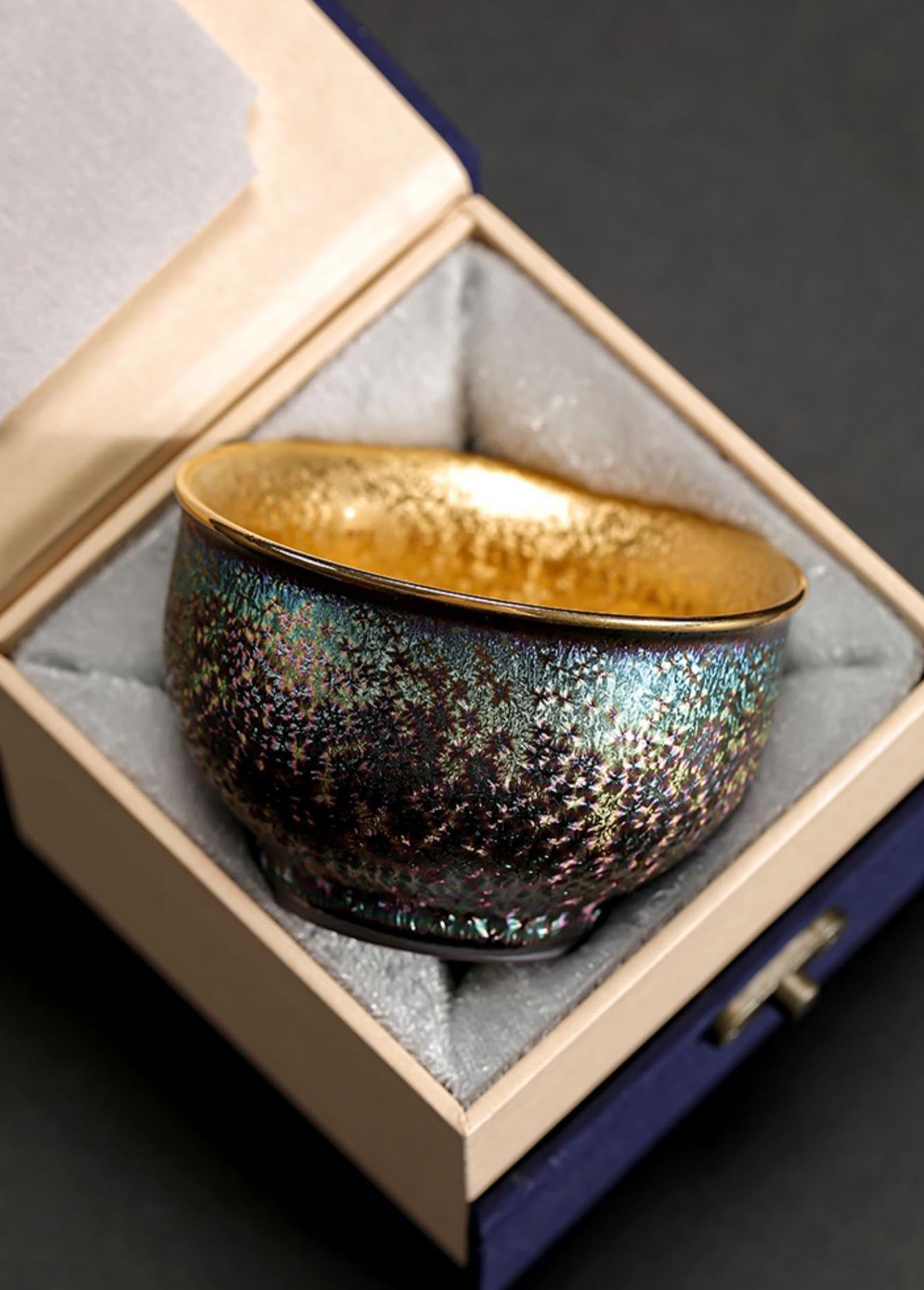 Peacock Luster Gilded Teacup - Majestic Ceramic Artistry from Dehua