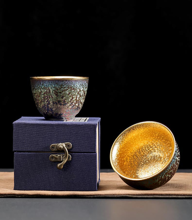 Peacock Luster Gilded Teacup - Majestic Ceramic Artistry from Dehua