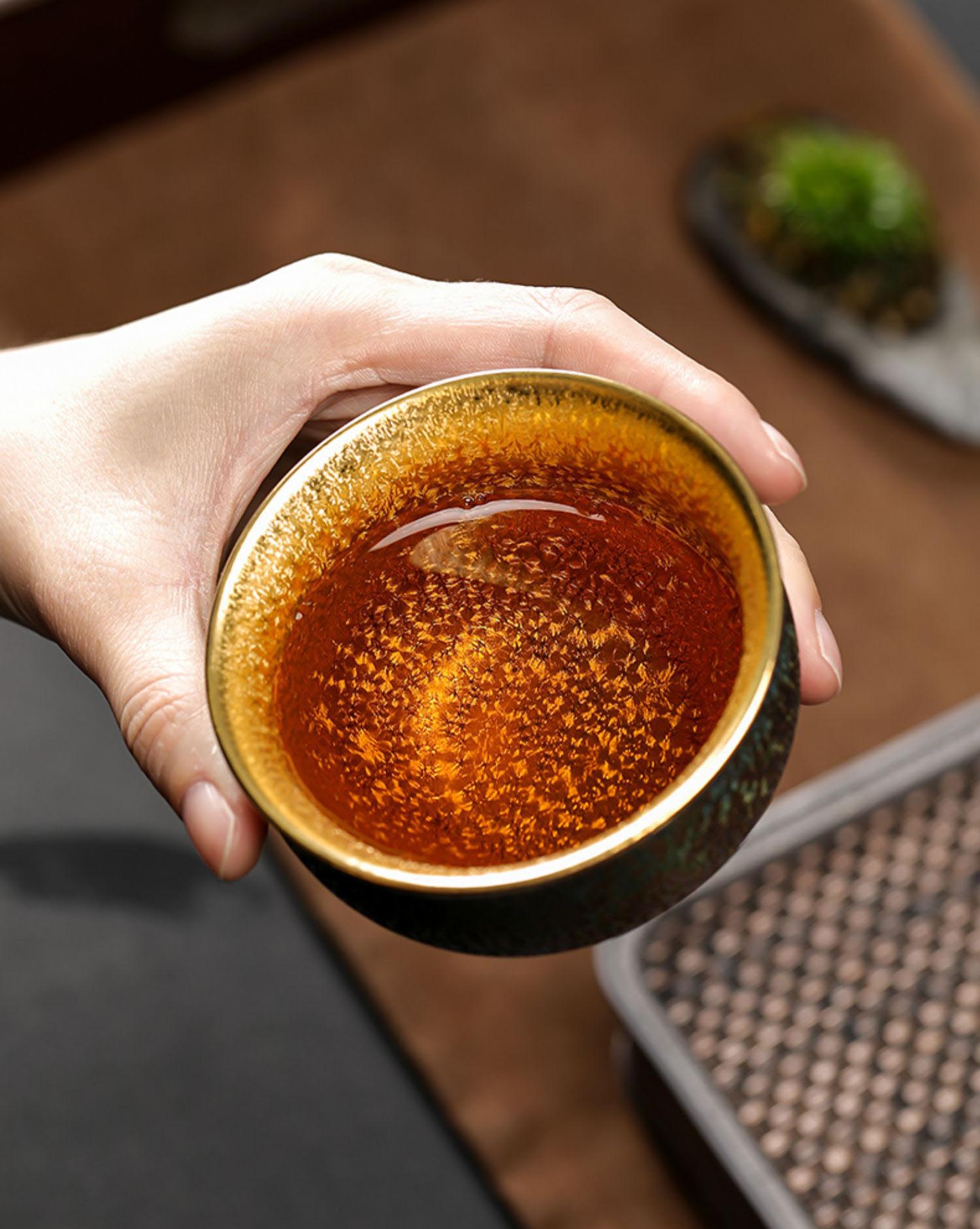Peacock Luster Gilded Teacup - Majestic Ceramic Artistry from Dehua