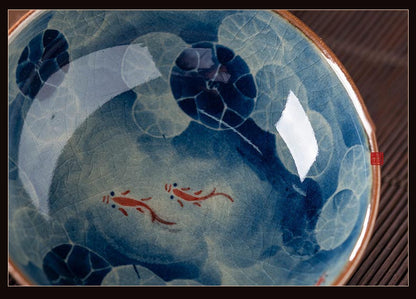 Handcrafted Jian Zhan Jingdezhen Porcelain Tea Cup with Blue & White Lotus Fish Design