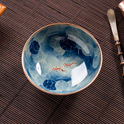 Handcrafted Jian Zhan Jingdezhen Porcelain Tea Cup with Blue & White Lotus Fish Design
